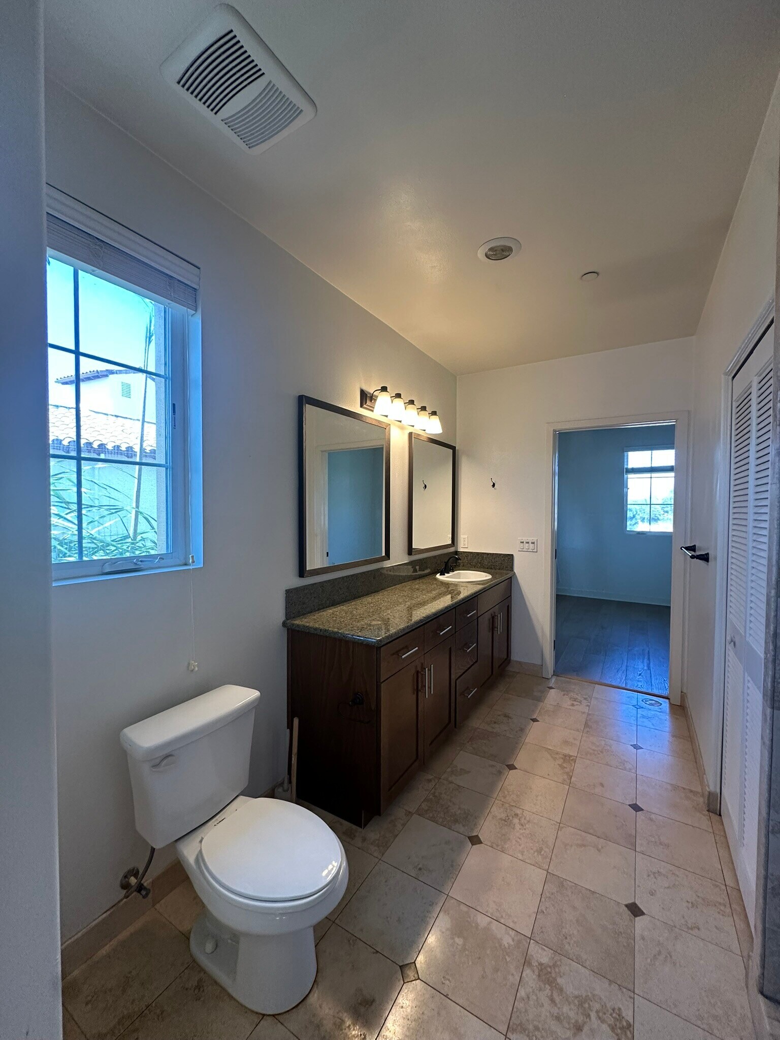view of master bathroom as you leave large walkin closet at the end. facing the master bedroom - 130 N Garden St