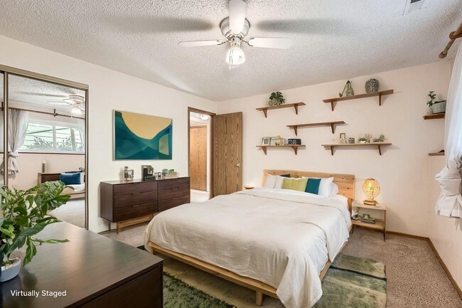 Building Photo - Spacious 2-Bed Townhome with Private Yard & 2-Car Garage in Aurora