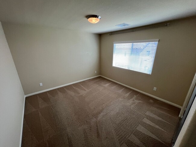 Building Photo - A Fantastic 4 Bedroom Home with the primary Downstairs, in Silverado Ranch