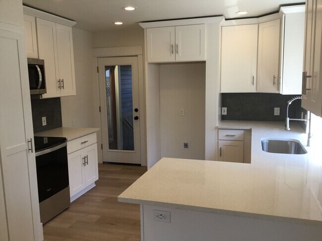 Building Photo - GOURMET KITCHEN/OPEN FLOOR PLAN