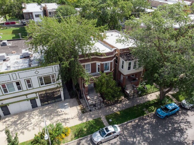 Building Photo - Modern 4BR Apartment with Hardwood Floors, Balcony & Central A/C