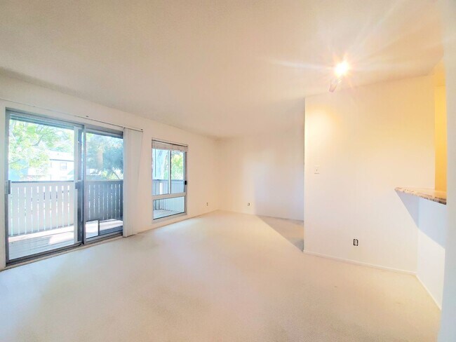 Building Photo - Top floor studio with large patio & greenb...