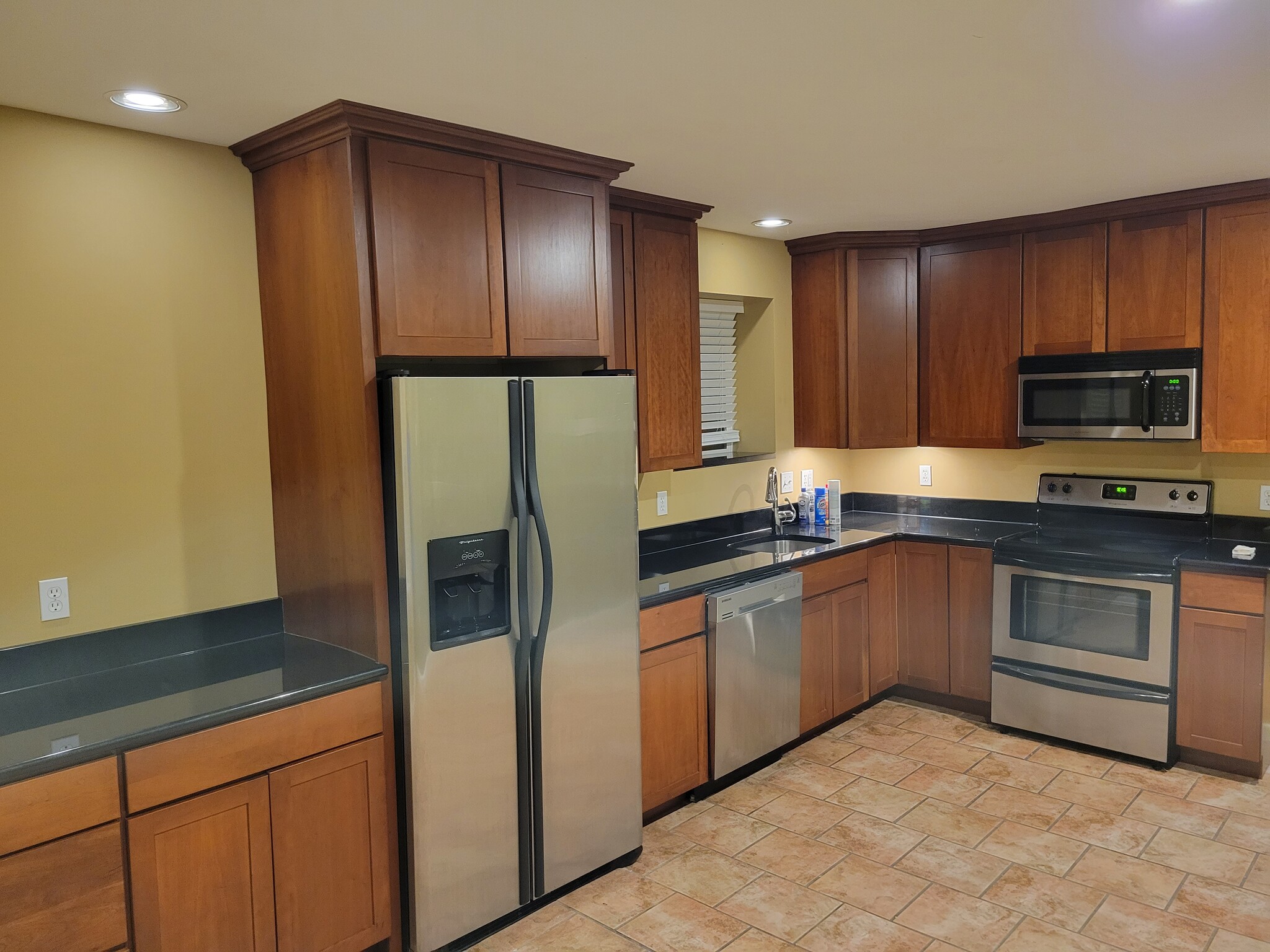 Updated Kitchen with Black Granite Countertop and Stainless Appliance Package - 7230 W Park Ave