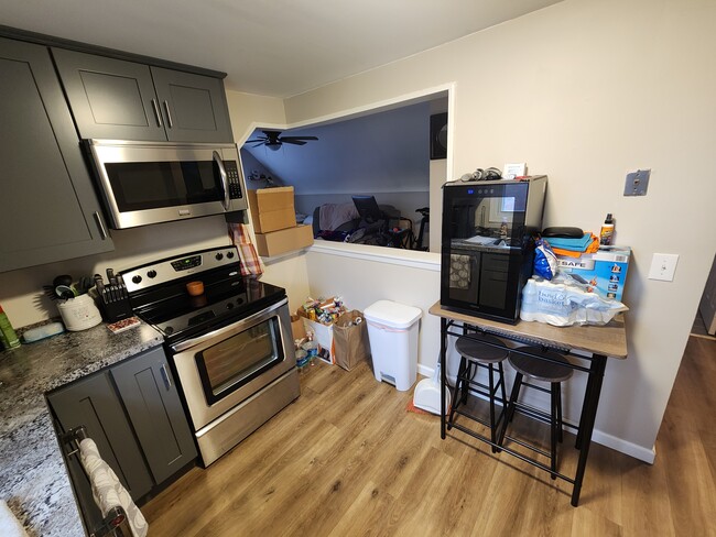 Eat in kitchen nook, half wall into living room. - 79 Pacecrest Ct