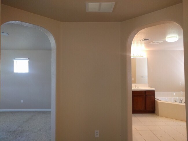Building Photo - Gated Community Stunner ready to be called...