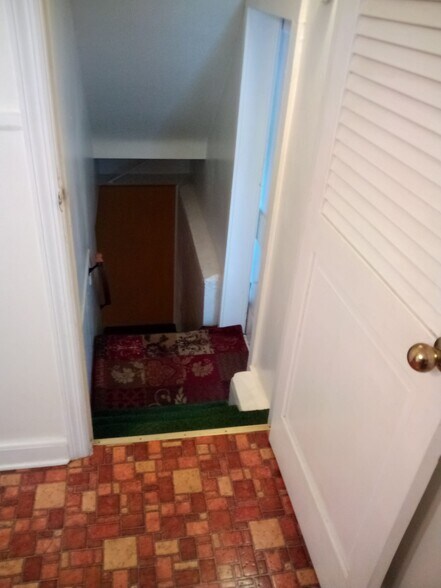 Stairs from Garage Leading to Basement and Kitchen - 207 Sunflower Ave
