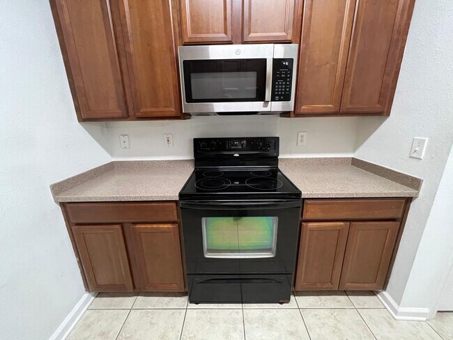 Building Photo - Spacious 3 bedroom condo located in a gated community off of Beach Boulevard