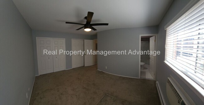 Building Photo - Spacious, Updated Condominium with Two Ful...