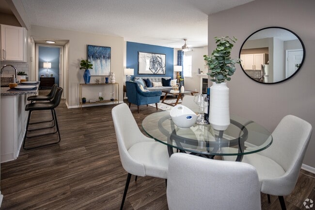 Spacious living room with hardwood-style flooring - Alden