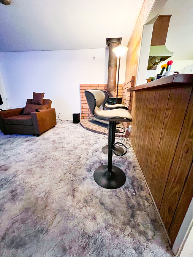 Large living room with great serve thru bar/table from kitchen - 15875 Lawrence Dr