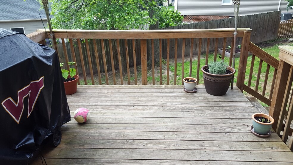 Back deck with fenced in yard. - 12604 Paget Ct