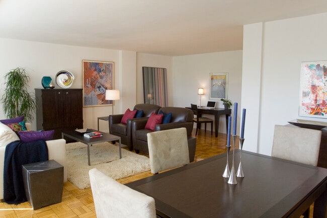 Dining and living area with hardwood flooring - The Albemarle