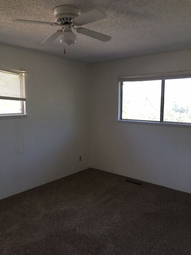 Building Photo - Downtown home with loft and exposed beam ceilings.