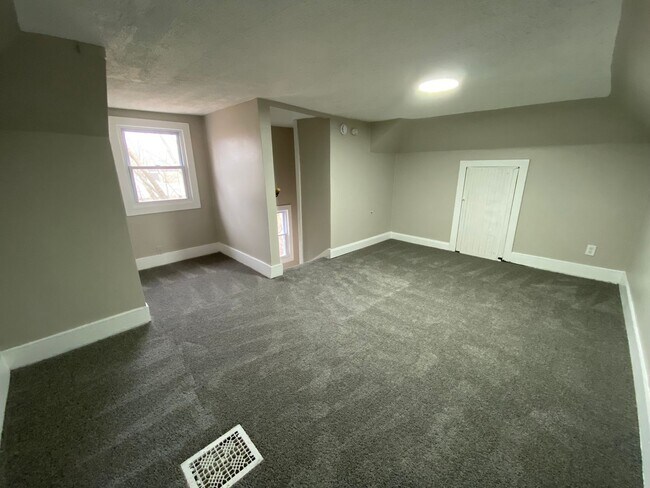 Building Photo - More Space Than You’d Expect: Updated 3BR w/ 1.5 Baths + Carpeted Attic Bonus