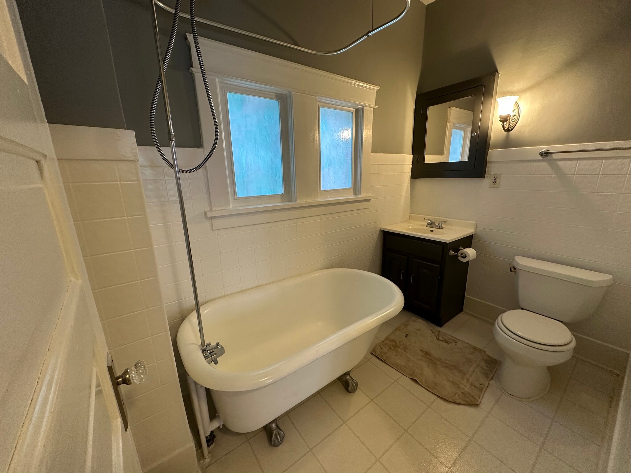 Bathroom with newly glazed claw foot soaking tub. - 1030 N Church St