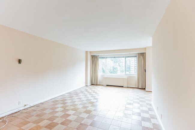 Building Photo - Light-filled studio in the prestigious Towers Condominium, nestled in the heart of Wesley Heights...