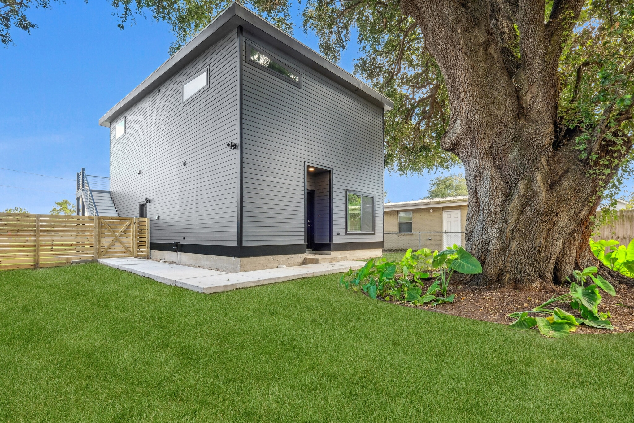 Fenced yard (Backyard grass is simulated) - 428 W Solidelle St