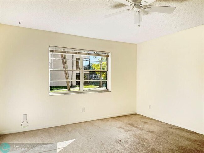 Building Photo - 6090 N Sabal Palm Blvd