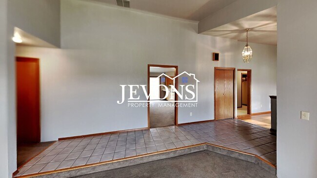 Building Photo - Enjoy this 3-bedroom home featuring a fully equipped kitchen, a two-car attached garage, and a fe...