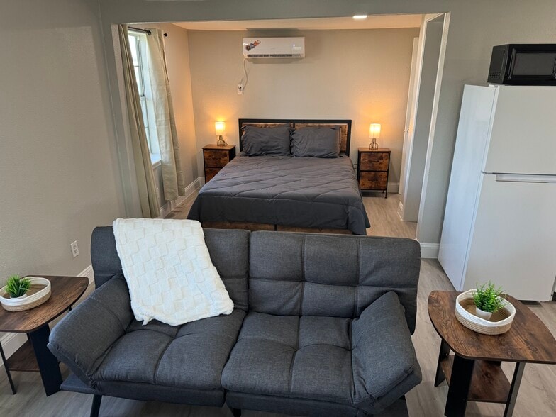 Futon and Queen bed - 5202 County Road 469