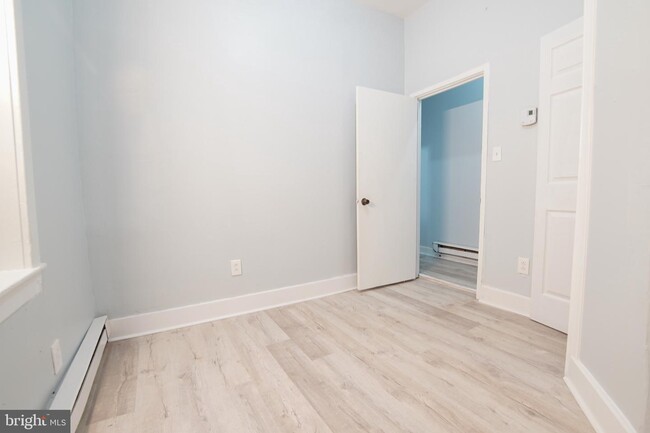 Building Photo - 7022 Woodland Ave