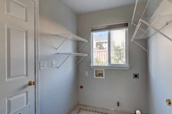 Building Photo - Spacious 4-Bedroom Home with Cozy Backyard...