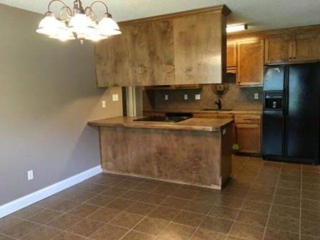 Building Photo - Spacious 3BR Brick Home with Open Split Floor Plan & Tiled Back Porch on Nearly an Acre