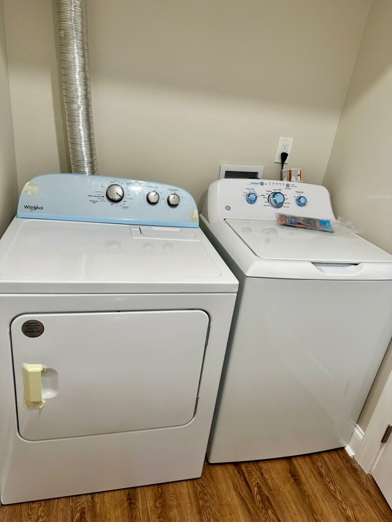 Side-by-side washer and dryer conveniently located on the second floor for easy access. - 55 Providence Ave