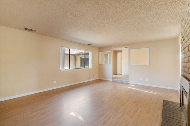 living room facing foyer and courtyard - 5079 E BREMER AVE