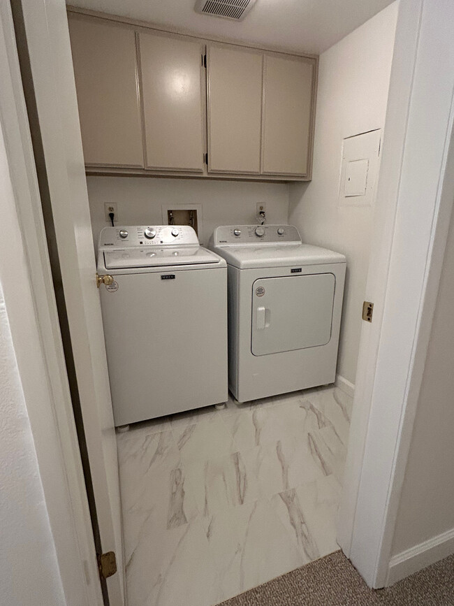 Laundry Room with storage cabinets located inside the condo unit - 285 S Sierra Madre Blvd