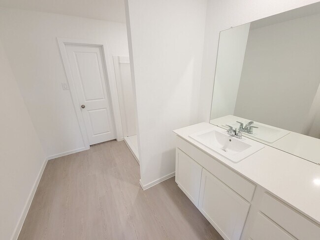 Building Photo - This great new single-story design makes smart use of the space available. At the front are all t...