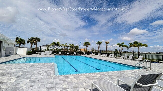 Building Photo - EXCEPTIONAL AND SPACIOUS FURNISHED TOWNHOME WITHIN WATERSIDE- NAUTIQUE!