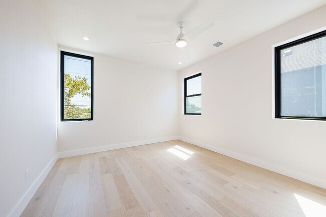 Building Photo - Luxury Redefined: Experience Vibrant Living in this 3-Bedroom Haven in East Austin