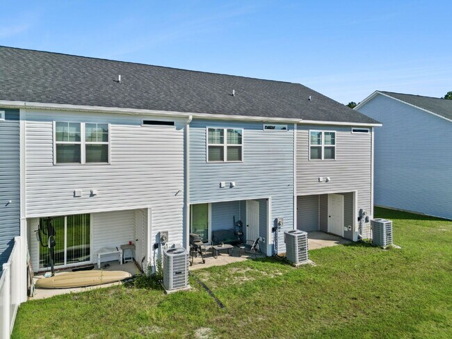 Building Photo - Available Now! Enjoy low-maintenance coastal living in this beautiful 2-bedroom, 2.5-bath townhom...