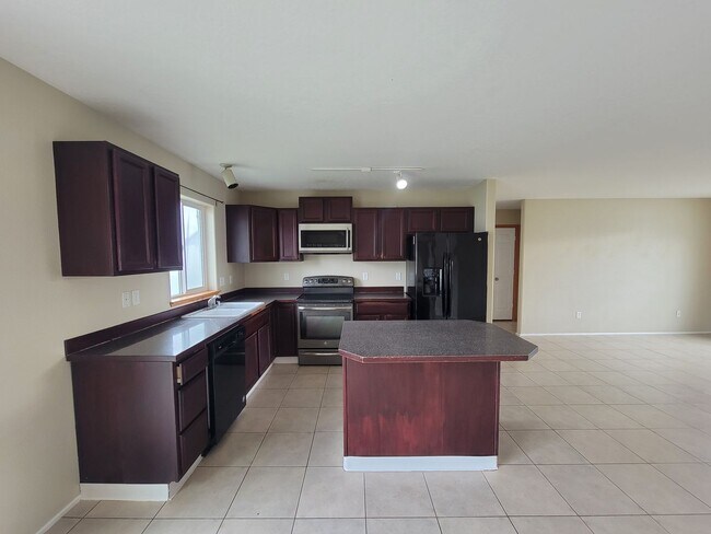 Building Photo - Comfortable 4-Bedroom Home with Fenced Bac...