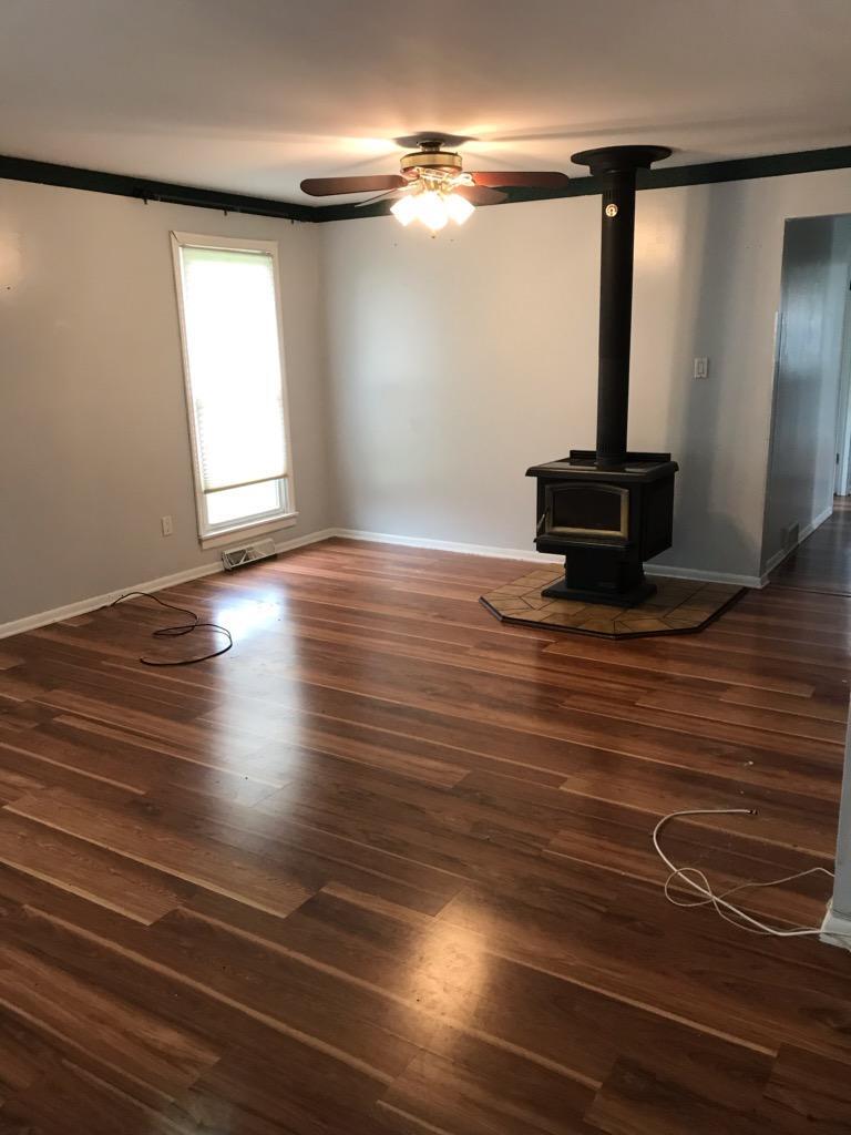 Living Room wood burning stove - 1110 N French Rd