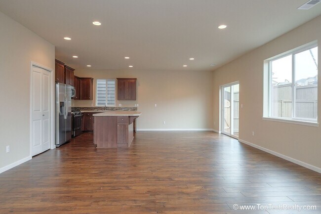 Building Photo - Spacious 4-Bedroom + Office Home in Abbey Creek – Modern Finishes, EV Charger & Low-Maintenance B...