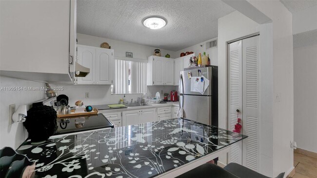 Building Photo - 7935 W 30th Ct