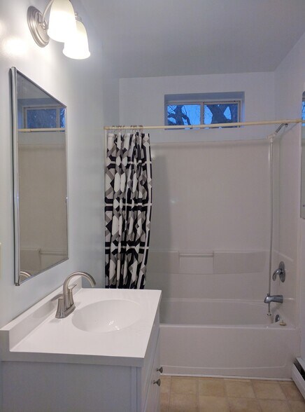 Bathroom with tub - 100 N Main St
