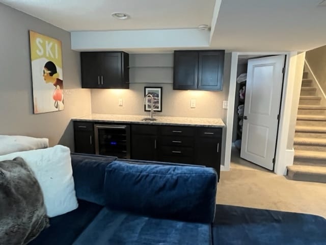 Lower living area with bar and full bath - 2840 Leyden St