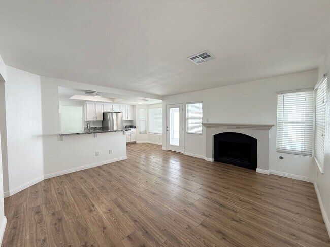 Building Photo - Corner Lot Beauty with Open Living, Guest Suite Down & Expansive Backyard