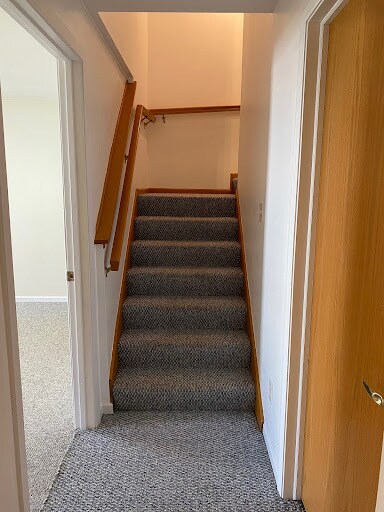 Stairway: bedroom door on left, storage door on right. - 9 Daytona Beach Dr