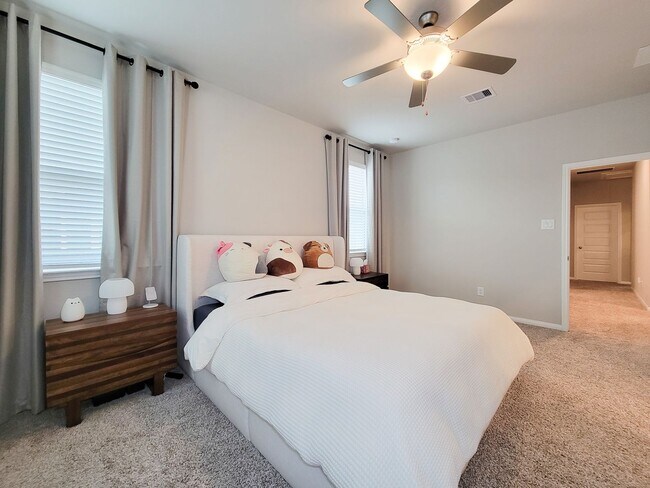 Building Photo - A true gem on a quiet corner lot, this spacious and sun-filled home is tucked away from street no...