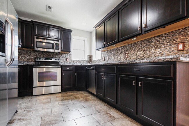 Building Photo - Pet Friendly Four Bedroom with Basement!