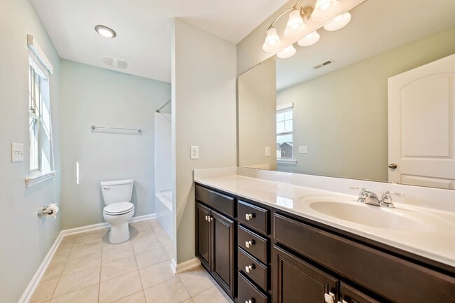 Building Photo - AVAILABLE IN MAY!  Stunning, like-new 4 bedroom, 4 bath home with large fenced yard!