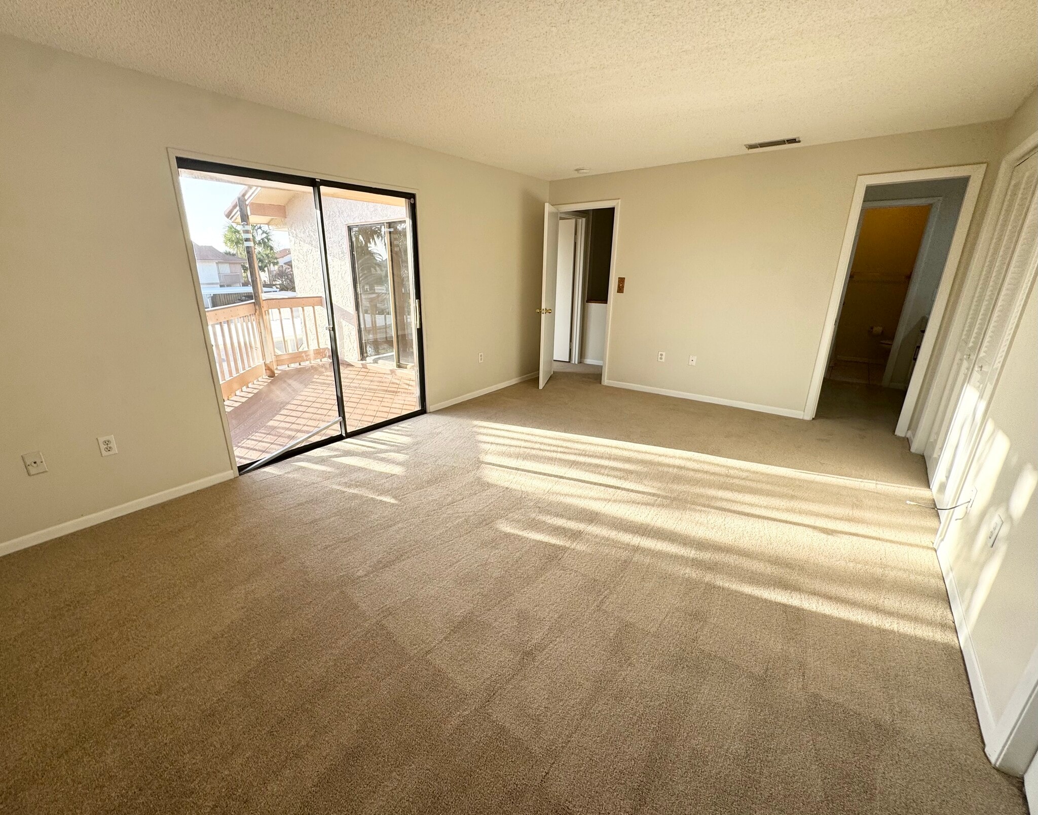 Primary Bedroom with Balcony - 200 S Banana River Blvd