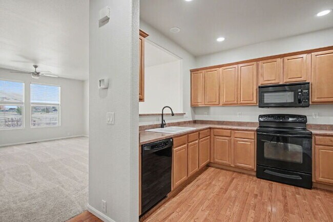 Building Photo - Beautifully Updated 3-Bedroom End-Unit Townhome Facing Open Space with Attached 2-Car Garage in G...