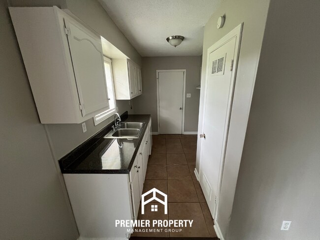 Building Photo - HALF OFF FIRST MONTHS RENT! Charming 3BR/1.5BA in 38118 | Hardwood Floors & Spacious Fenced Backyard