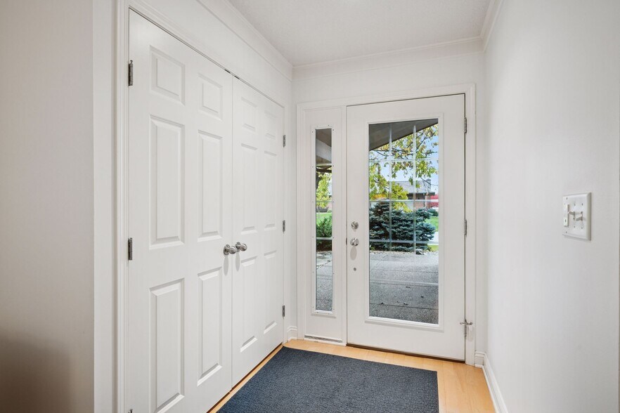 Step into this inviting entryway with engineered wood floors throughout the main living areas - 145 Holly Ln N