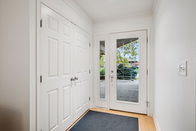 Step into this inviting entryway with engineered wood floors throughout the main living areas - 145 Holly Ln N